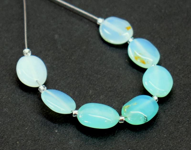 PERUVIAN BLUE OPAL- OVALS - TASSEL: " TASSEL"- means the drilled pieces of gemstones are loosely attached with a wire , ideally you can use it to create of of a kind jewelry . STONE : NATURAL EARTH MINED BLUE OPALS FROM PERU - OVAL SHAP