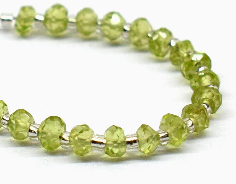 PERIDOT - RONDELLE 3 mm - TASSEL: " TASSEL"- means the drilled pieces of gemstones are loosely attached with a wire , ideally you can use it to create of of a kind jewelry . STONE : NATURAL EARTH MINED FINE PERIDOT RONDELLE SHAPE BEAD
