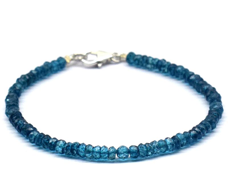 BLUE TOPAZ BRACELET W/ 925 SILVER: These are Natural , earth mined LONDON BLUE TOPAZ faceted rondelle beads finished with SOLID 925 Sterling Silver lobster clasp. All chains and spacers are also Solid 925 Sterling Silver. Length of bra