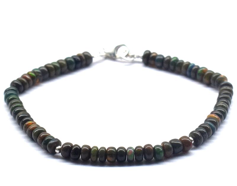 ETHIOPIAN OPAL BRACELET W/ 925 SILVER: These are Natural , earth mined ETHIOPIAN OPAL plain rondelle beads finished with SOLID 925 Sterling Silver lobster clasp. All chains and spacers are also Solid 925 Sterling Silver. Length of bracelet