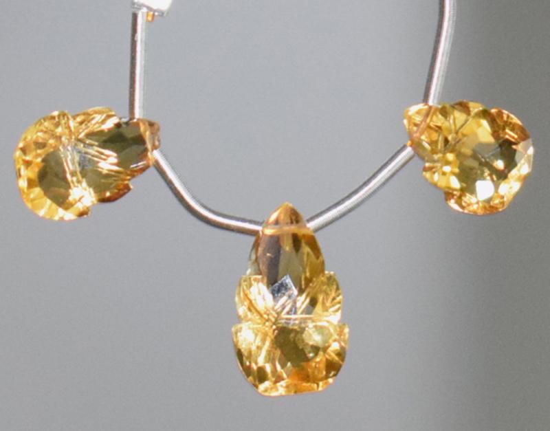 CARVED CITRINE BRIOLETTE BEADS - TASSEL: " TASSEL"- means the drilled pieces of gemstones are loosely attached with a wire , ideally you can use it to create of of a kind jewelry . STONE : NATURAL GEMSTONE FINE CITRINE FACETED CARVED BRIOLET