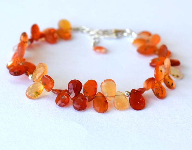 MEXICAN FIRE OPAL BRIOLETTE BRACELET W/ 925 SILVER: These are Natural , earth mined FIRE OPAL faceted briolette pear beads finished with SOLID 925 Sterling Silver lobster clasp. All chains and spacers are also Solid 925 Sterling Silver. Clasp is adjust