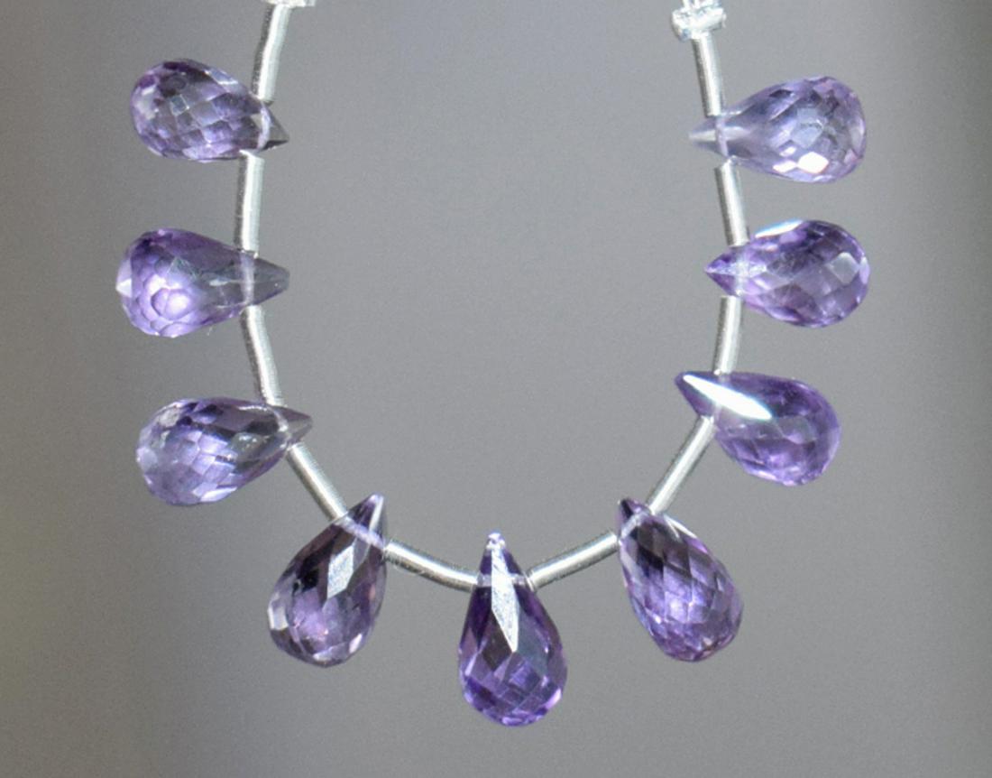 AMETHYST - BRIOLETTE 4X7 - 5X9 mm - TASSEL: " TASSEL"- means the drilled pieces of gemstones are loosely attached with a wire , ideally you can use it to create of of a kind jewelry . STONE : NATURAL EARTH MINED FINE AMETHYST FACETED BRIOLETTE 