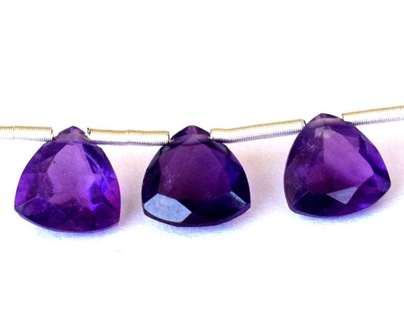 NATURAL AMETHYST - TRIANGLE 7 mm - TASSEL: TASSEL- means the drilled pieces of gemstones are loosely attached with a wire , ideally you can use it to create of of a kind jewelry . STONE : NATURAL GEM QUALITY AMETHYST FACETED TRIANGLE BEADS . A