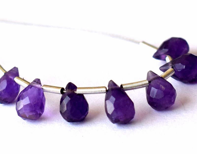 AMETHYST - BRIOLETTES 4X6 - 5X7 mm - TASSEL: " TASSEL"- means the drilled pieces of gemstones are loosely attached with a wire , ideally you can use it to create of of a kind jewelry . STONE : NATURAL AFRICAN AMETHYST FACETED BRIOLETTE BEADS . A