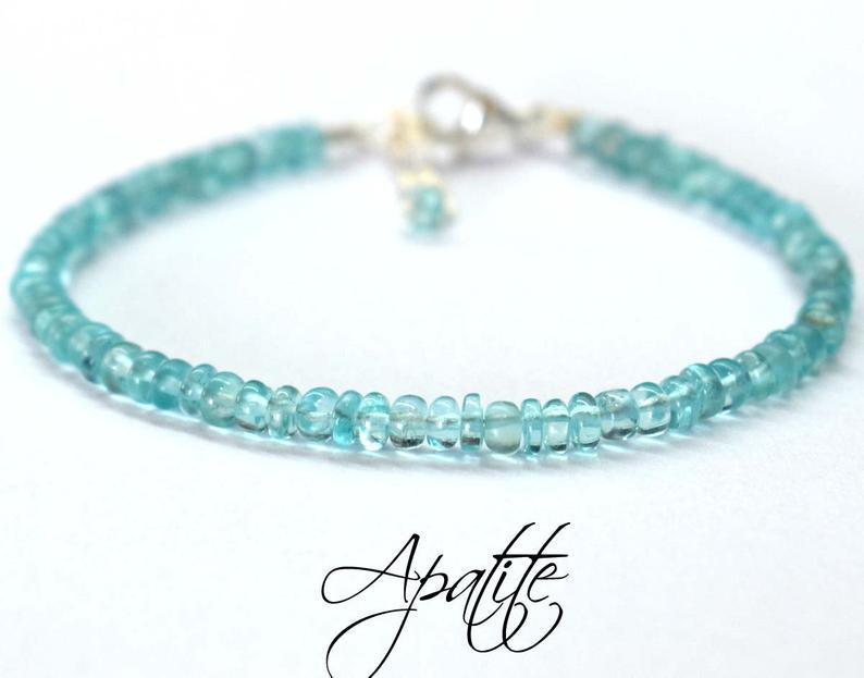 APATITE BRACELET W/ 925 STERLING SILVER: These are Natural , earth mined APATITE rondelle shape beads finished with SOLID 925 Sterling Silver lobster clasp. All chains and spacers are also Solid 925 Sterling Silver. Clasp is adjustable from 