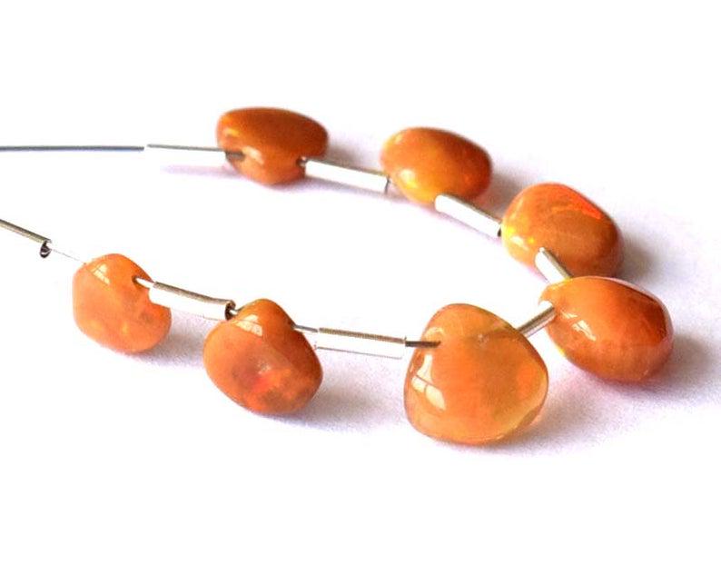 ETHIOPIAN OPAL - HEART 5 - 7 mm - TASSEL: TASSEL- means the drilled pieces of gemstones are loosely attached with a wire , ideally you can use it to create of of a kind jewelry . STONE : NATURAL GEM QUALITY ETHIOPIAN OPAL HEART BEADS . All th