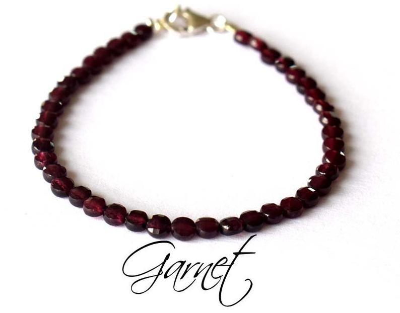 GARNET BRACELET W/ 925 STERLING SILVER: These are Natural , earth mined GARNET faceted coin shape beads finished with SOLID 925 Sterling Silver lobster clasp. All chains and spacers are also Solid 925 Sterling Silver. Bracelet length is 7" 