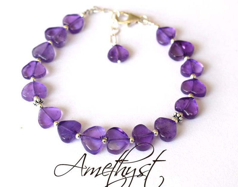 AMETHYST BRACELET W/ 925 STERLING SILVER: These are Natural , earth mined AMETHYST topdrill heart shape beads finished with SOLID 925 Sterling Silver lobster clasp. All chains and spacers are also Solid 925 Sterling Silver. Clasp is adjustabl