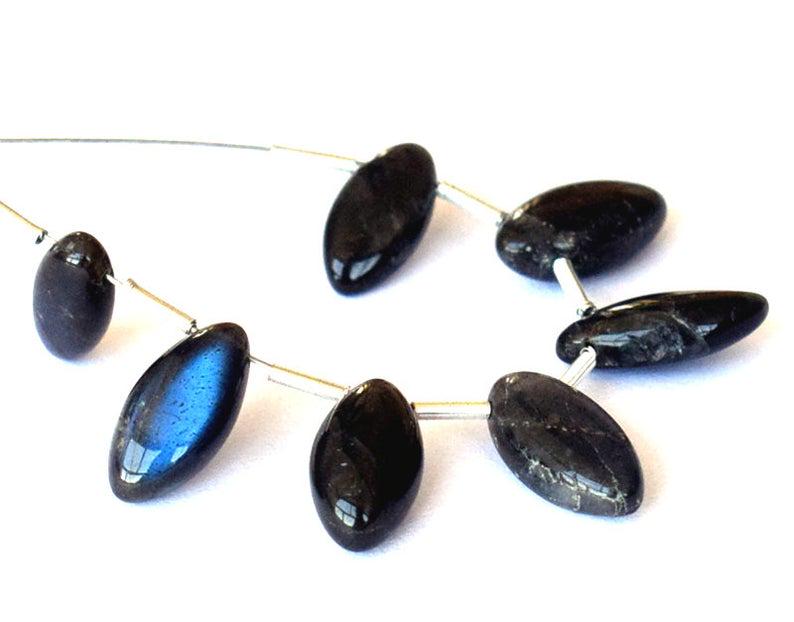 LABRADORITE - MARQUISE 5X9 mm - TASSEL: TASSEL- means the drilled pieces of gemstones are loosely attached with a wire , ideally you can use it to create of of a kind jewelry . STONE : NATURAL GEM QUALITY BLUE HUE LABRADORITE MARQUISE BEADS