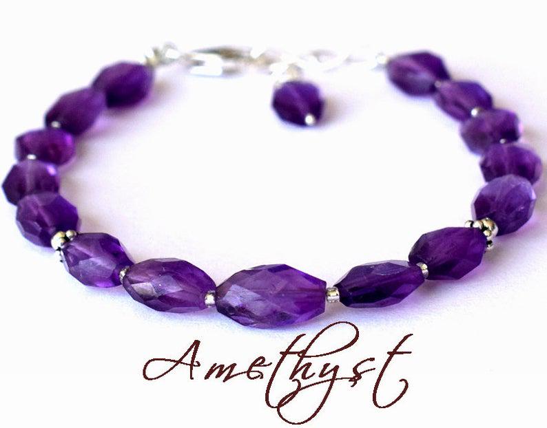 AMETHYST BRACELET W/ 925 STERLING SILVER: These are Natural , earth mined AMETHYST faceted oval shape beads finished with SOLID 925 Sterling Silver lobster clasp. All chains and spacers are also Solid 925 Sterling Silver. Clasp is adjustable 
