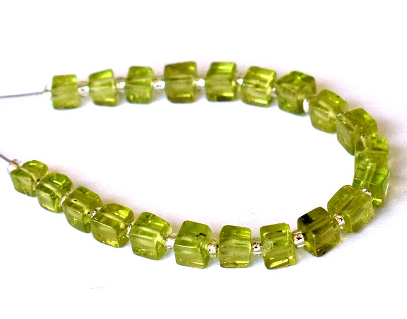 PERIDOT - BOX 3 - 3.5 mm - TASSEL: " TASSEL"- means the drilled pieces of gemstones are loosely attached with a wire , ideally you can use it to create of of a kind jewelry . STONE : NATURAL EARTH MINED FINE PERIDOT BOX SHAPE BEADS . A