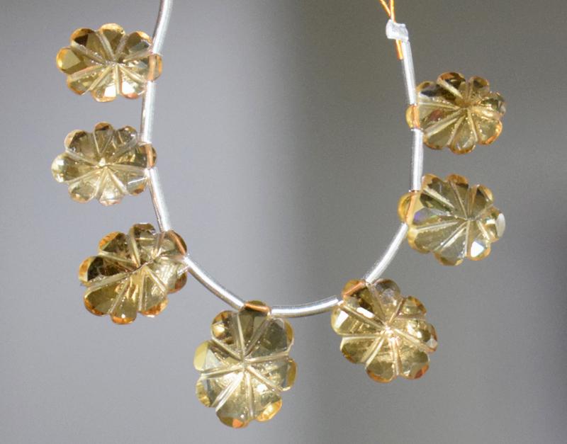 CARVED CITRINE OVAL BEADS - LASER -CUT , TASSEL: " TASSEL"- means the drilled pieces of gemstones are loosely attached with a wire , ideally you can use it to create of of a kind jewelry . STONE : NATURAL GEMSTONE FINE CITRINE CARVED FACETED OVAL BE
