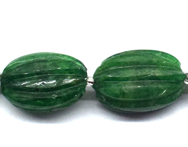 TSAVORITE GARNET CARVED OVAL - TASSEL: " TASSEL"- means the drilled pieces of gemstones are loosely attached with a wire , ideally you can use it to create of of a kind jewelry . STONE : NATURAL GEM QUALITY TSAVORITE GARNET CARVED OVAL BEA
