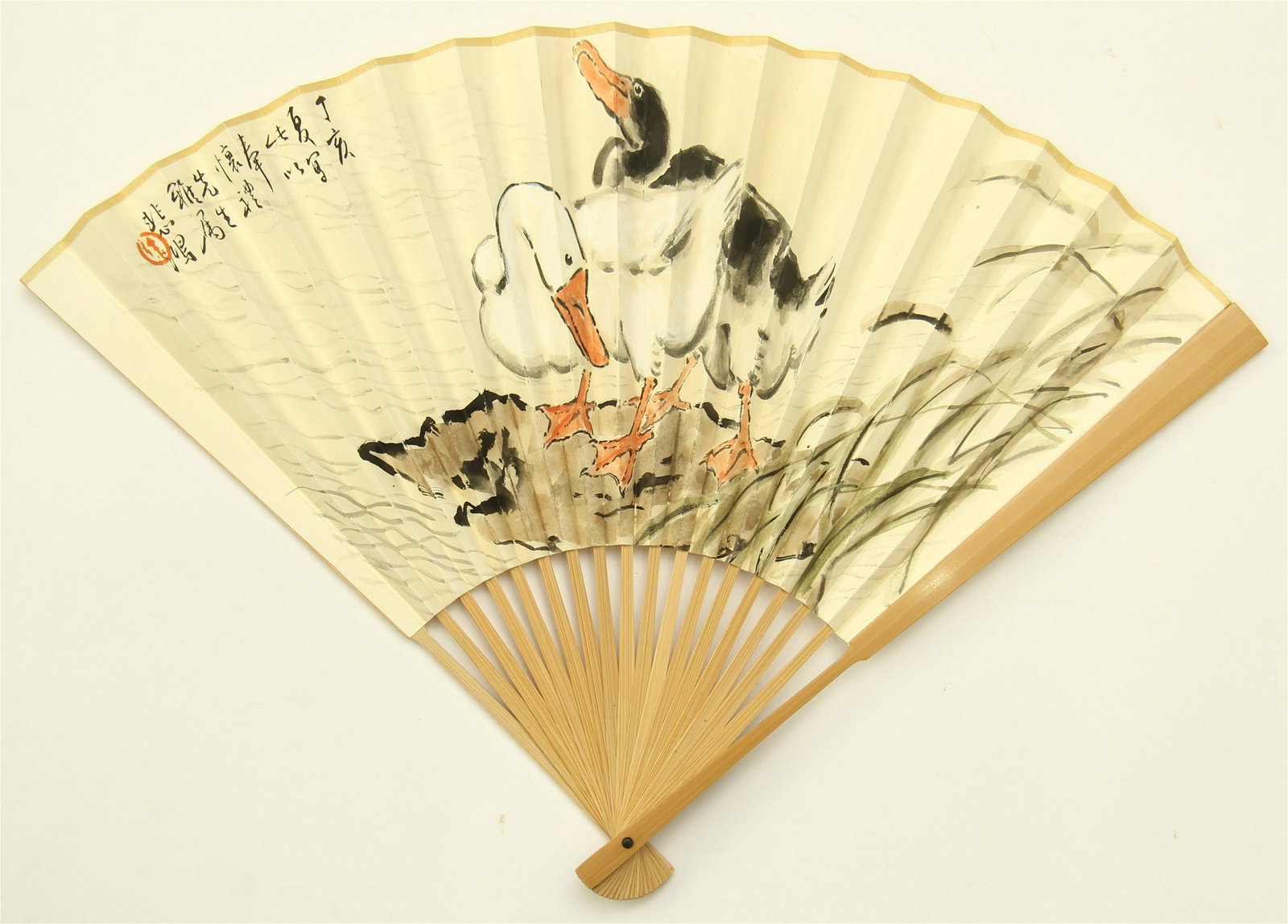 A CHINESE FAN PAINTING OF GOOSES BY XU BEIHONG: 31.5 cm. Shipping cost $30 to US 48 states and $100 for oversea International delivery. Local pickup at our office available but need pay in advance. Combined shipping available to save shipping cost.