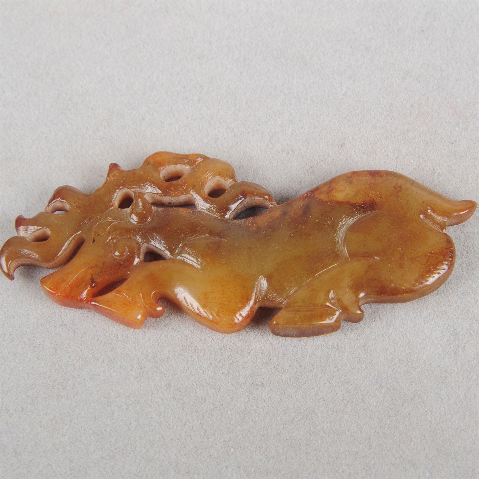 A CHINESE NEPHRITE JADE BEAST PLAQUE (1 of 3)