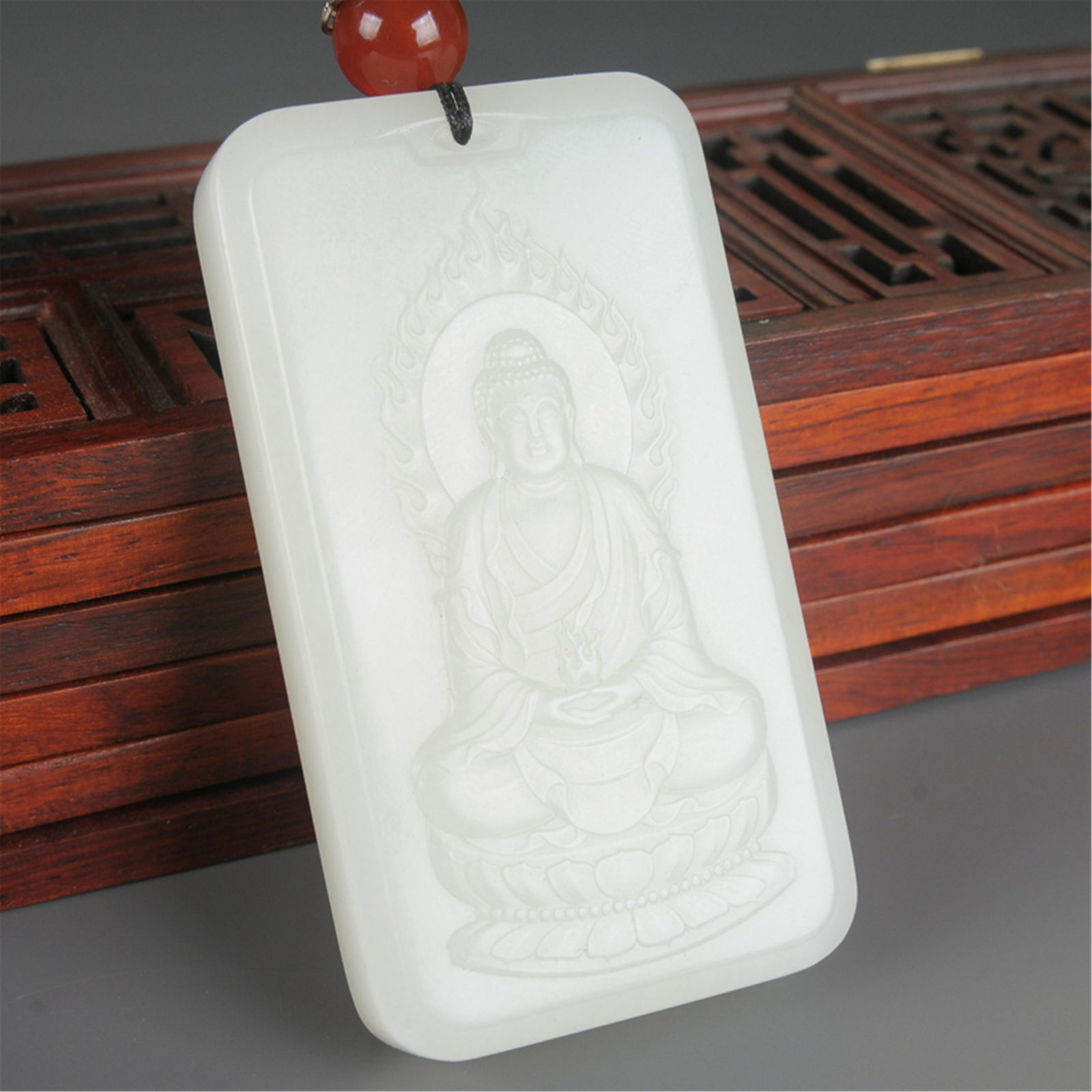 A CHINESE WHITE HETIAN JADE BUDDHA PLAQUE (1 of 3)