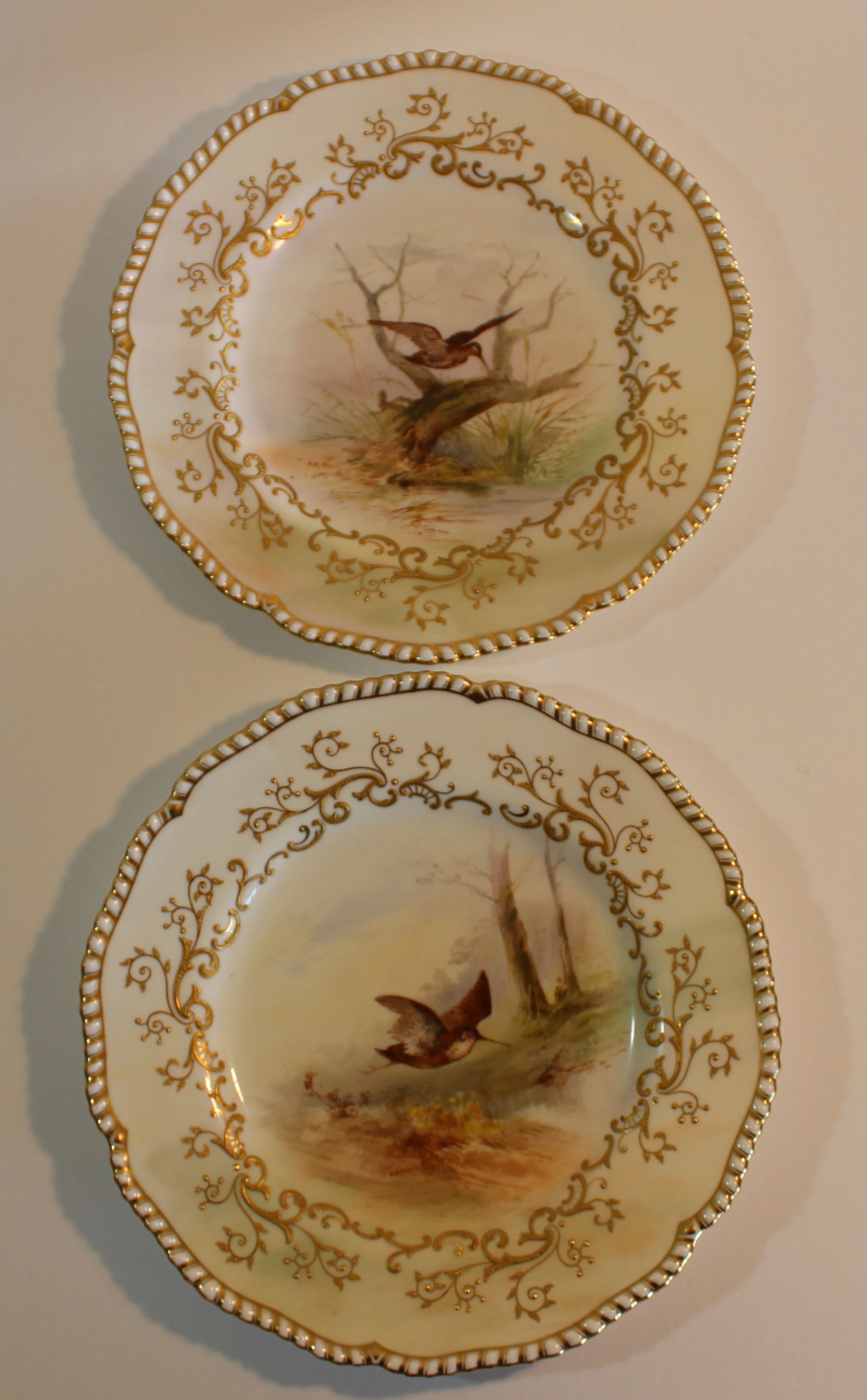 PAIR OF COALPORT PORCELAIN BIRD PLATES: Antique pair of Coalport porcelain cabinet plates hand painted with birds. H in.