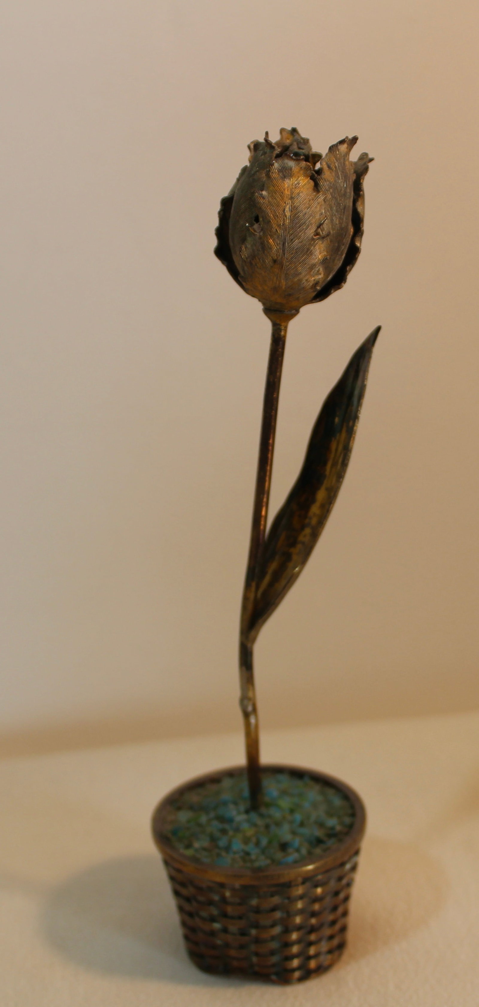 TIFFANY STERLING SILVER FLOWER IN BASKET: Vintage Tiffany & Co. sterling silver tall flower in a basket with some gold gilt wash remaining. 6 inches tall.
