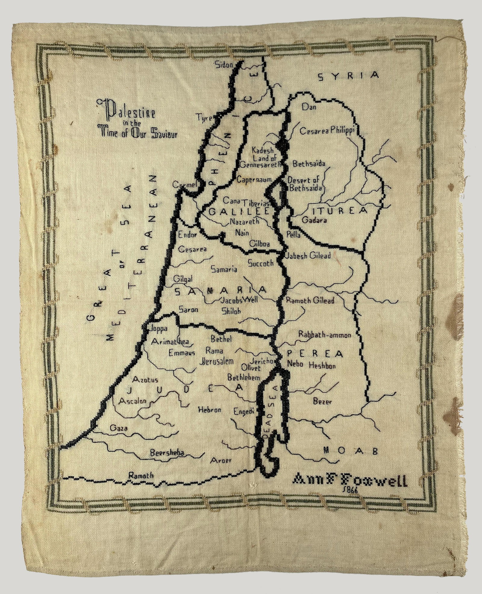 Embroidered Map of the Holy Land - 1866: Embroidery Sampler with a map of Palestine, dated 1866, wrought by Ann F. Foxwell, apparently in England.Approximately 33X41 cm. Good condition, stains, wear.