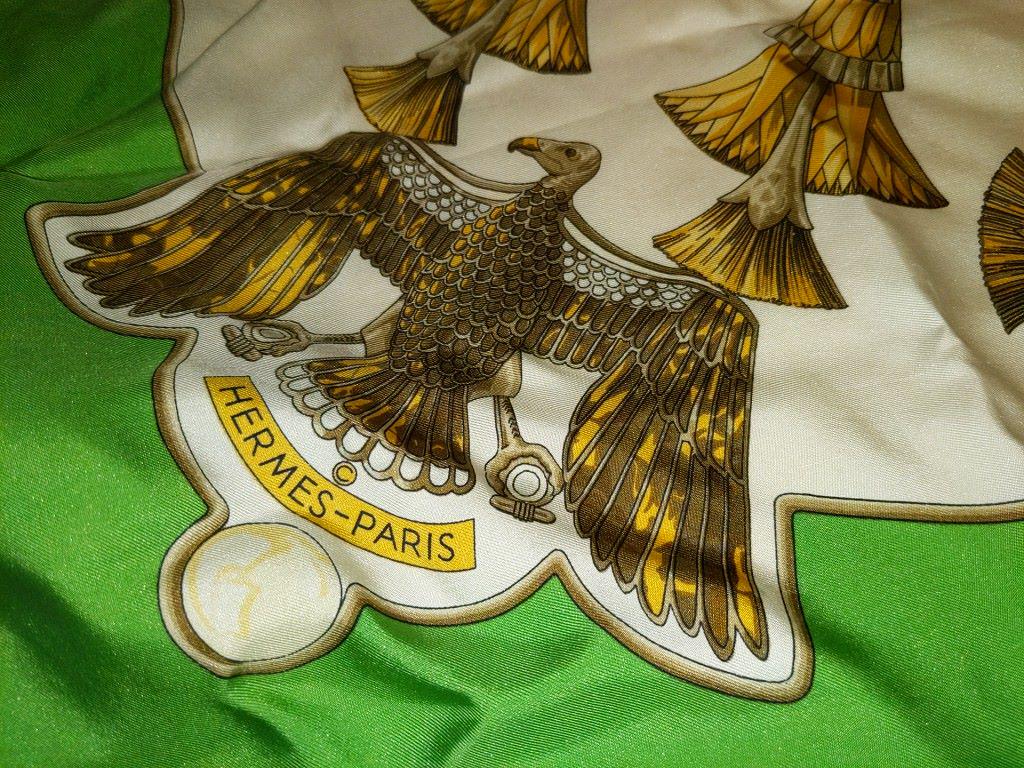 Hermes Caty Latham Vintage Scarf 32x32". No: Hermes Caty Latham Vintage Scarf 32x32". No rips/tears/holes identified. A few small stains Photo'd. 32x32". No rips/tears/holes identified. A few small stains Photo'd.