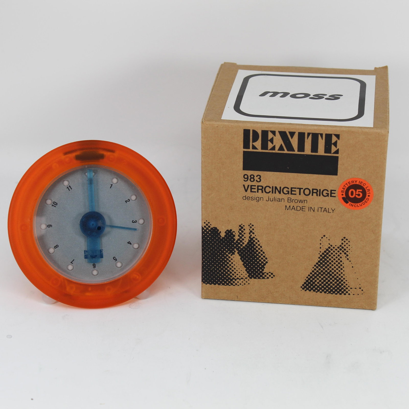 REXITE â€œVERCINGETORIGEâ€ DESK CLOCK COOPER HEWITT: Designed by Julian Brown Manufactured by Rexite SpA & Studio Brown Plastic housing, unique â€œflipper” release for accessing time setting and battery compartment Complete in original box and