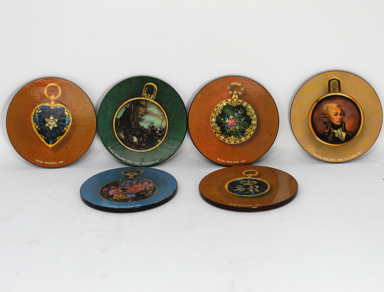 Patek Philippe Les collections dâ€™art: A set of 6 Patek Philippe artistic coasters circa 1977 Box:7.5"L x 4" W x 1"H Coaster: 3.5" Diameter
