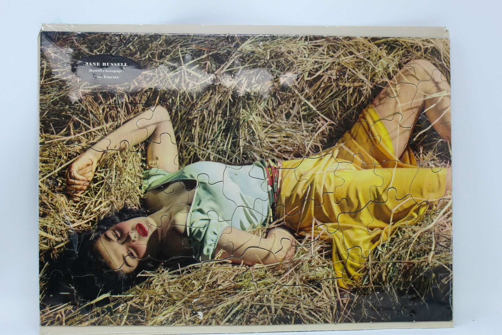 JANE RUSSELL JIGSAW PUZZLE (ca. 1943): JANE RUSSELL JIGSAW PUZZLE (ca. 1943) A tie-in to the movie "Outlaw” based on an Esquire magazine photo and offered as a mail-in premium, 10 x 13,” mint with original envelope.