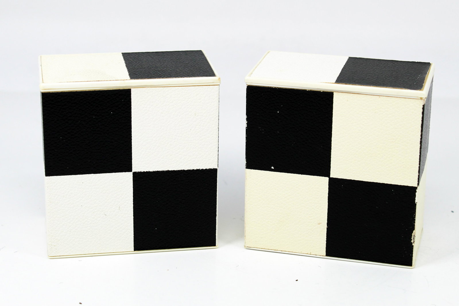 BULOVA CHECKERBOARD ALARM/TRAVEL CLOCKS (ca.: A checkerboard case design makes this clock really stand out and also protects it when you're traveling. Sturdy mechanical manual-wind movement. 2.75" length x 3" width