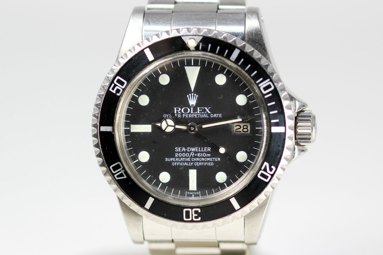 Vintage Rolex Oyster Perpetual Date Sea-Dweller with: Stainless Steel Vintage Rolex Oyster Perpetual Date Sea-Dweller with Date Wristwatch. Model 1665, Serial 6727801. 40mm diameter. Running at time of cataloging.