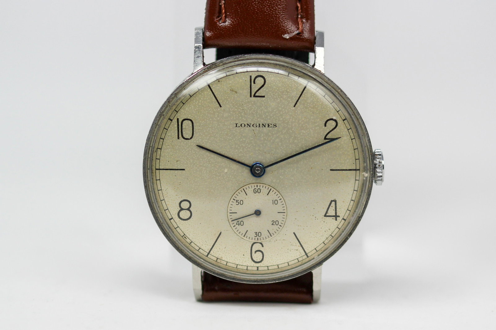 Vintage Longines Steel Wristwatch: Stainless Steel Vintage Longines Wristwatch. 37mm diameter. Running at time of cataloging.
