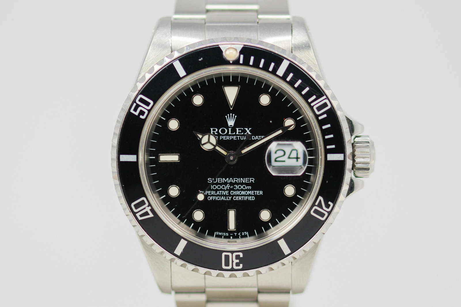 Vintage Rolex Oyster Perpetual Date Submariner Wristwatch: Stainless Steel Vintage Rolex Oyster Perpetual Date Submariner Wristwatch on Stainless Steel Rolex bracelet; Model 16610, Serial # S311937. 40mm diameter. Running at time of cataloging.