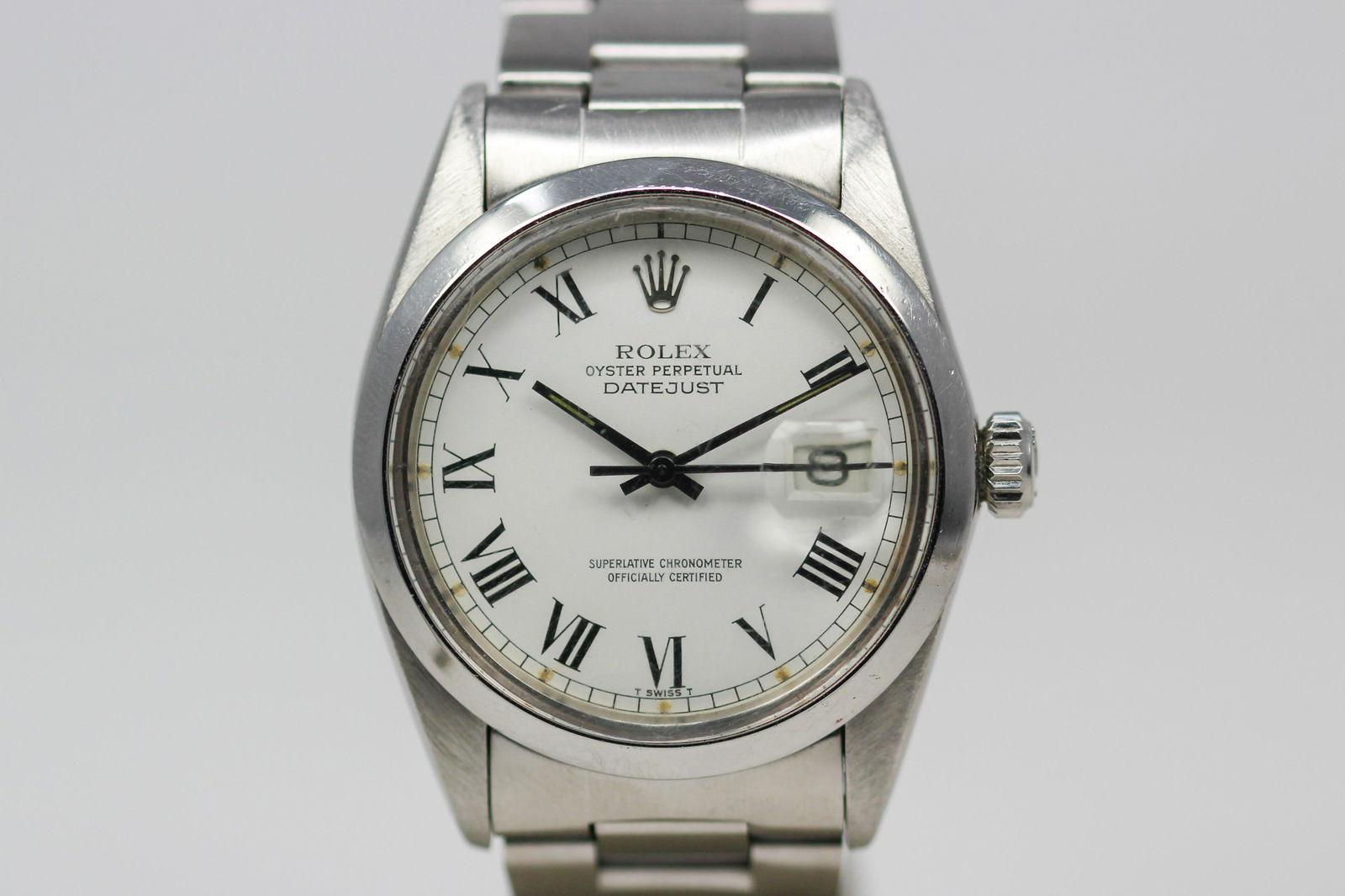 Vintage Rolex Oyster Perpetual Datejust Wristwatch with Original Rolex Certificate: Stainless Steel Vintage Rolex Oyster Perpetual Datejust Wristwatch on Stainless Steel Rolex bracelet with Original Rolex Certificate; Model 16000, Serial # 7261795. 36mm diameter. Running at time of c