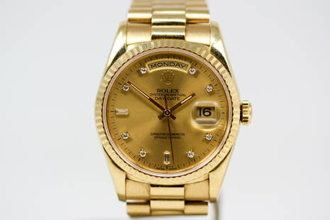 Vintage Rolex Oyster Perpetual Day-Date Wristwatch in 18k Yellow Gold: 18k Yellow Gold Vintage Rolex Oyster Perpetual Day-Date Wristwatch on 18k Yellow Gold Rolex bracelet with Factory Diamond Dial; Model 18238, Serial # W540435. 36mm diameter. Running at time of