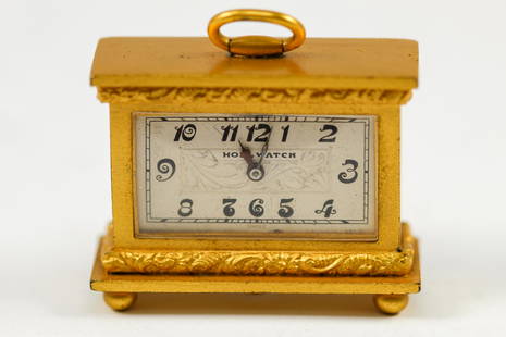 Antique Holl Watch Miniature Table Clock: 1960's winding desk movement. Manufactured by Holl Watches. Gold plated. 36mm x 13mm x 26mm.