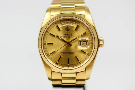 Vintage Rolex Oyster Perpetual Day-Date Wristwatch in 18k Yellow Gold: 18k Yellow Gold Vintage Rolex Oyster Perpetual Day-Date Wristwatch on 18k Yellow Gold Rolex bracelet; Model 18038, Serial # 5385329. 36mm diameter. Running at time of cataloging.