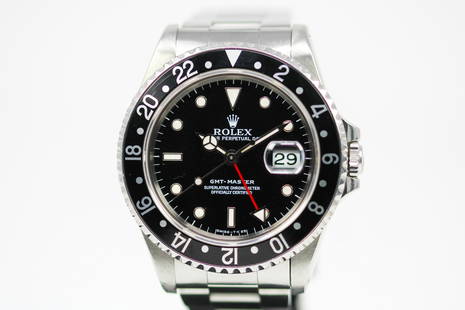 Vintage Rolex Oyster Perpetual Date GMT-Master Wristwatch with Rolex Certificate: Stainless Steel Vintage Rolex Oyster Perpetual Date GMT-Master Wristwatch on Stainless Steel Rolex bracelet with Rolex Certificate; Model 16700, Serial # S197503. 40mm diameter. Running at time of