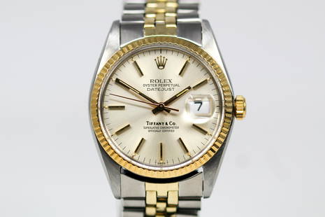 Two-Tone Vintage Rolex Oyster Perpetual "Tiffany & Co." Datejust Wristwatch with Rolex Guarantee: Two-Tone Vintage Rolex Oyster Perpetual "Tiffany & Co." Datejust Wristwatch on Two-Tone Rolex bracelet with Rolex Guarantee Card; Model 16013, Serial # 5549277. 36mm diameter. Running at time of