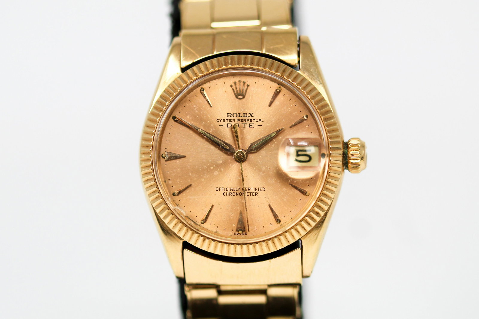 Vintage Rolex Oyster Perpetual Date Wristwatch in 18k Yellow Gold: 18k Yellow Gold Vintage Rolex Oyster Perpetual Date Wristwatch on 18k Yellow Gold Rolex bracelet; Model 6627, Serial # 792169. 30mm diameter. Running at time of cataloging.