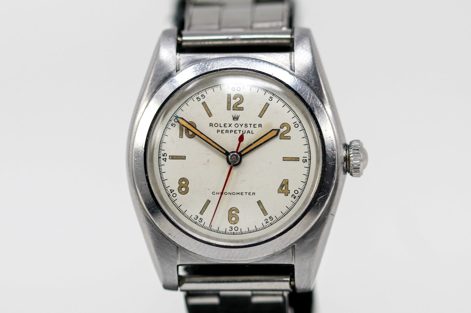 Vintage Rolex Oyster Perpetual Wristwatch: Stainless Steel Vintage Rolex Oyster Perpetual Wristwatch on Stainless Steel Rolex bracelet; Model 2940, Serial # 249561. 32mm diameter. Running at time of cataloging.