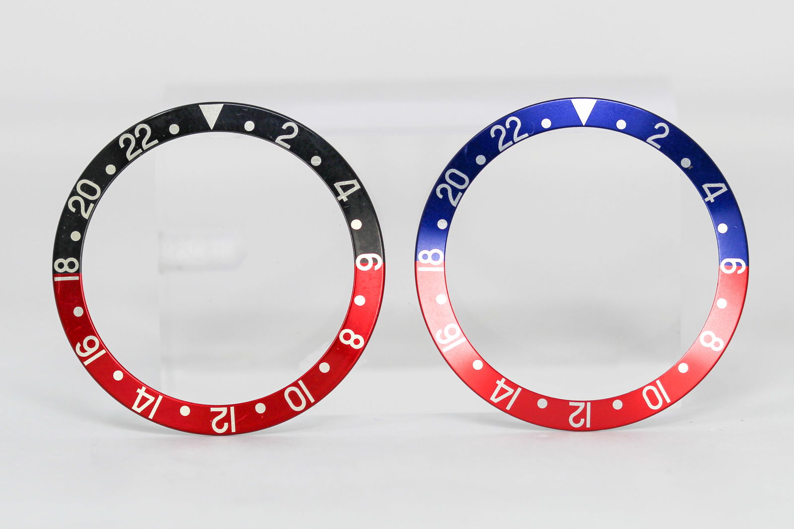 Loose Vintage Rolex GMT Bezels: Loose Vintage Rolex GMT Bezels. Red and blue bezel and red and black bezel. 38mm diameter. Loose watch parts.