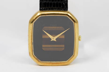 Vintage Piaget Tiger Eye Wristwatch in 18k Yellow Gold: 18k Yellow Gold Vintage Piaget Wristwatch *Screw Missing from Case Back, Only 3 Present*; Serial # 310842. 29mm diameter. Not running.