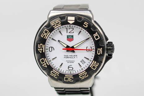 Vintage Tag Heuer Formula 1 with Date Wristwatch: Stainless Steel Vintage Tag Heuer Formula 1 with Date Wristwatch on Stainless Steel Tag Heuer bracelet; Model WAC1111-1, Serial # RWJ3169. 42mm diameter. Not running.