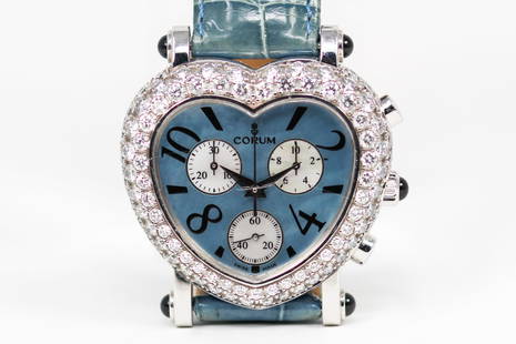 Corum Heart Shaped Chronograph Wristwatch with Factory Diamond Bezel in 18k White Gold: 18k White Gold Corum Heart Shaped Chronograph Wristwatch with Factory Diamond Bezel; Ref 196.183.69, Serial # 672523. 37mm diameter. Not running.