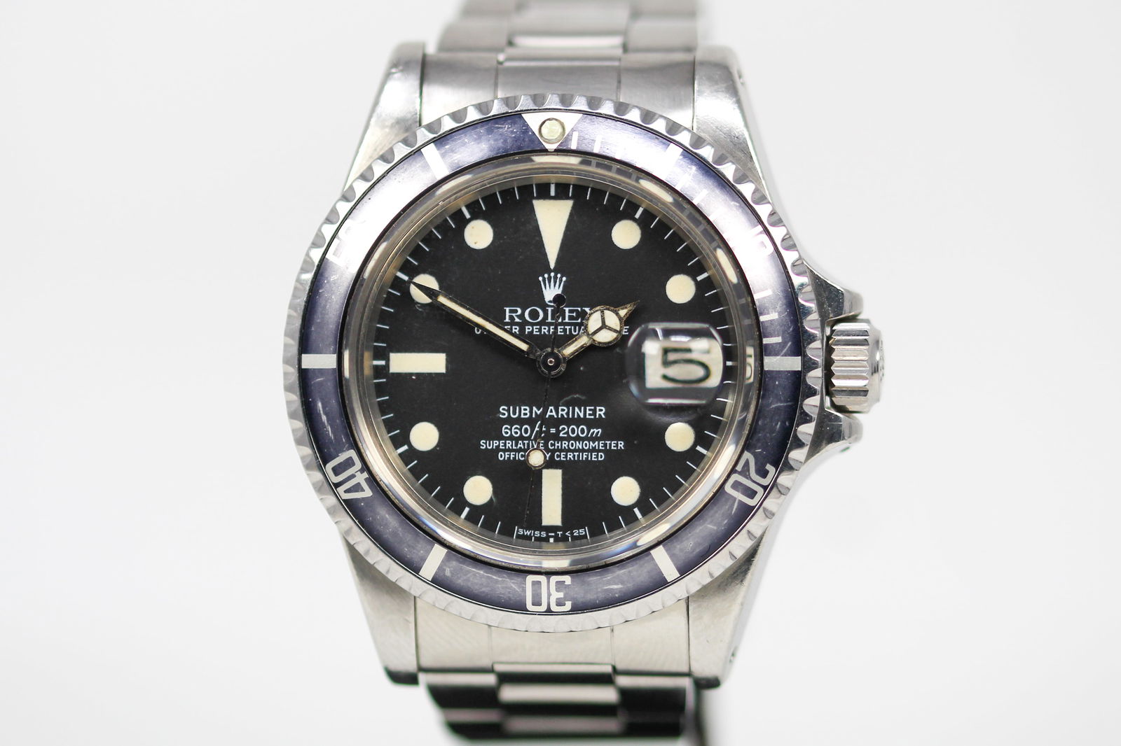 Vintage Rolex Oyster Perpetual Date Submariner Wristwatch: Stainless Steel Vintage Rolex Oyster Perpetual Date Submariner Wristwatch on Stainless Steel Rolex bracelet; Model 1680, Serial # 5552026. 40mm diameter. Running at time of cataloging. As clearly spel