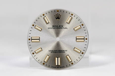 Loose Rolex Oyster Perpetual Dial *Retired Watchmaker's Collection*: Loose Rolex Oyster Perpetual Dial *Retired Watchmaker's Collection*. Silver dial. 32mm diameter. Loose watch parts.