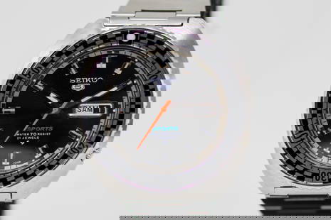 Seiko 5 Sports 21 Jewels with Day and Date Wristwatch: Stainless Steel Seiko 5 Sports 21 Jewels with Day and Date Wristwatch on Stainless Steel Seiko bracelet; Serial # 021039. 42mm diameter. Running at time of cataloging,