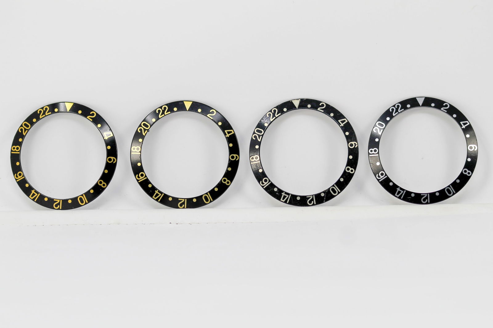 Loose Vintage Rolex GMT Bezels: Loose Vintage Rolex GMT Bezels. Black bezels. 38mm diameter. Loose watch parts.