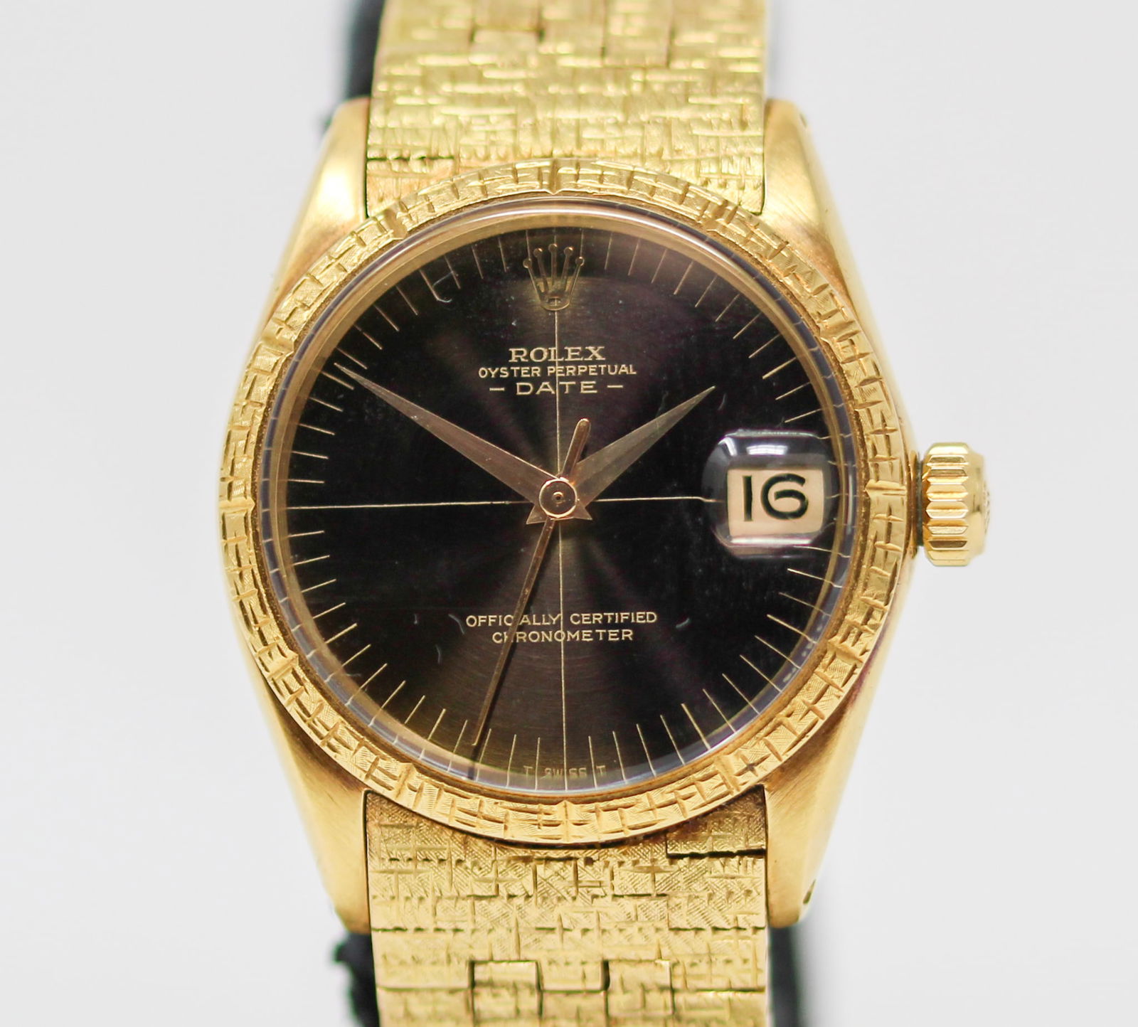 Vintage Rolex Oyster Perpetual Date Wristwatch in 18k Yellow Gold: 18k Yellow Gold Vintage Rolex Oyster Perpetual Date Wristwatch on 18k Yellow Gold Rolex Bracelet; Model 6636/6627, Serial # 1117300. 30mm diameter. Running at time of cataloging. As clearly spelled ou