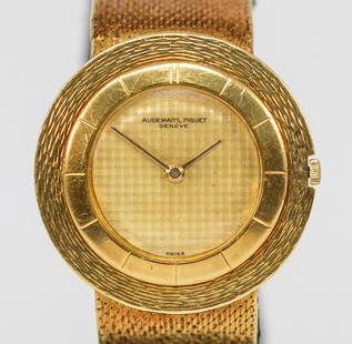 Vintage Audemars Piguet Disco Volante Wristwatch in 18k Yellow Gold: 18k Yellow Gold Vintage Audemars Piguet Disco Volante Wristwatch on Integrated 18k Yellow Gold Bracelet; Serial # 34886. 32mm diameter. Running at time of cataloging. As clearly spelled out in our Auc